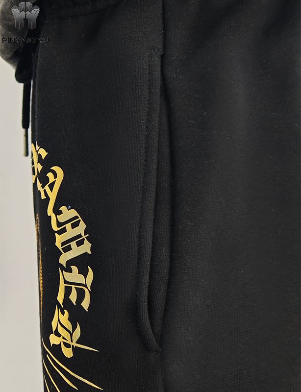 Pantalon avec motif strass et estampage doré