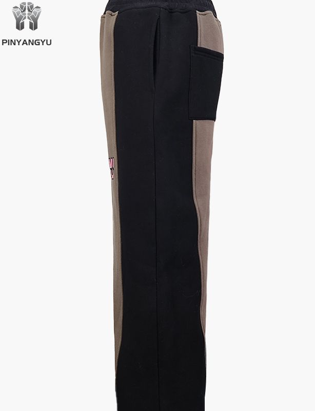 Pantalon de survêtement style tissu épissé avec motif brodé
